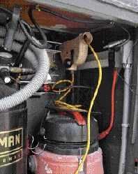 Inside the front compartment, an extension cord feeds to a GFCI outlet.