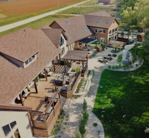 An aerial view shows the scale of the project, which spans more than 150 feet along the back of the house.