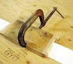 Because Durham's Water Putty expands fractionally as it sets up, the jig will ordinarily fit snugly over the molding. If necessary, the jig can be clamped to the molding through a slot cut in the side.
