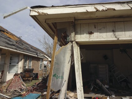 Another example shows the same pattern, as well as the failure of a garage door. In both cases, properly designed and installed portal frames would have likely improved the performance of the homes.
