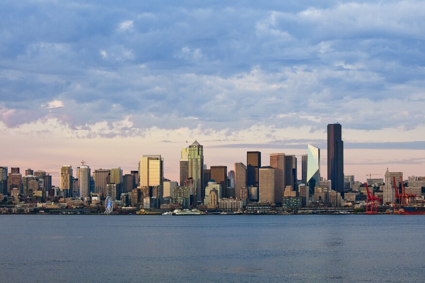 The Mark (toward the right) stands as a faceted glass tower in Seattle's skyline.