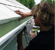Slipping the back of the gutter beneath a properly installed drip-edge prevents rainwater from running behind the gutter.