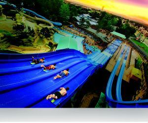 The sun sets on White Water in Branson, Mo., but the thrills will last well into the night. For a more relaxing option, guests can catch a movie by the wave pool.