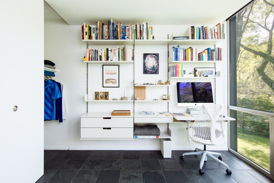 In an office, the firm opted to borrow the architect’s “clever soffit detail at the façade [to create] a similar nook in the closet.”