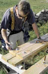 He labels each set of plates in preparation for concrete.