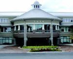 EIFS adds relief and color to tilt-up panels. On this building, EIFS is used to construct the white columns and the wall surfaces on the circular structure.