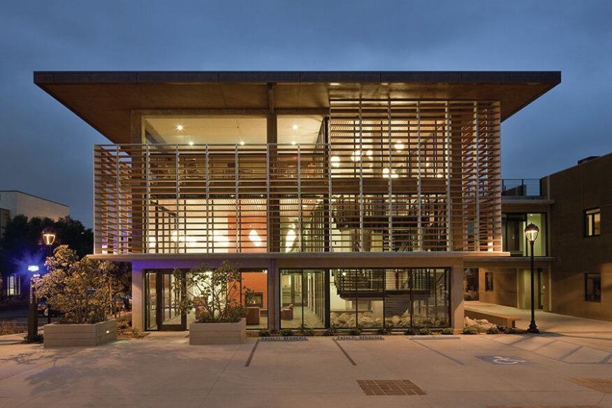Horizontal plank sunscreens help to reduce solar heat gain and glare on the adjacent floor-to-ceiling glass storefronts. Made of terracotta, they echo the color and materiality of the sloped clay tile roofs prevalent elsewhere on campus.