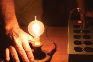 New Jersey manufacturer Larry Birnbaum switches on a treasured bulb presented to his grandfather, Samuel, by Thomas Edison in 1914.