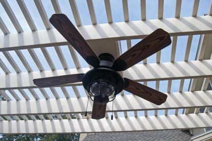 Mounting a ceiling fan attractively requires cooperation between the carpenters and the electrician.