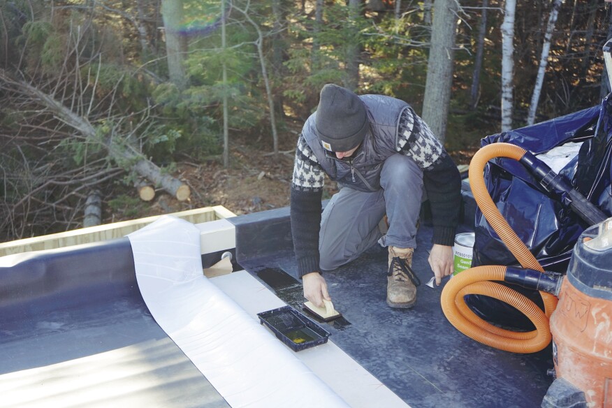 Crew member Finn Bradenday primed the EPDM at the lap joint.