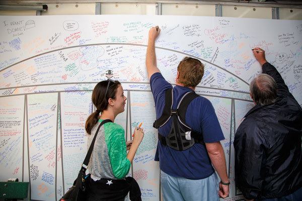 Visitors showed their support for saving the Astrodome by signing their names inside the "Dome-Mobile," rented by the group Preservation Houston during the firesale. 