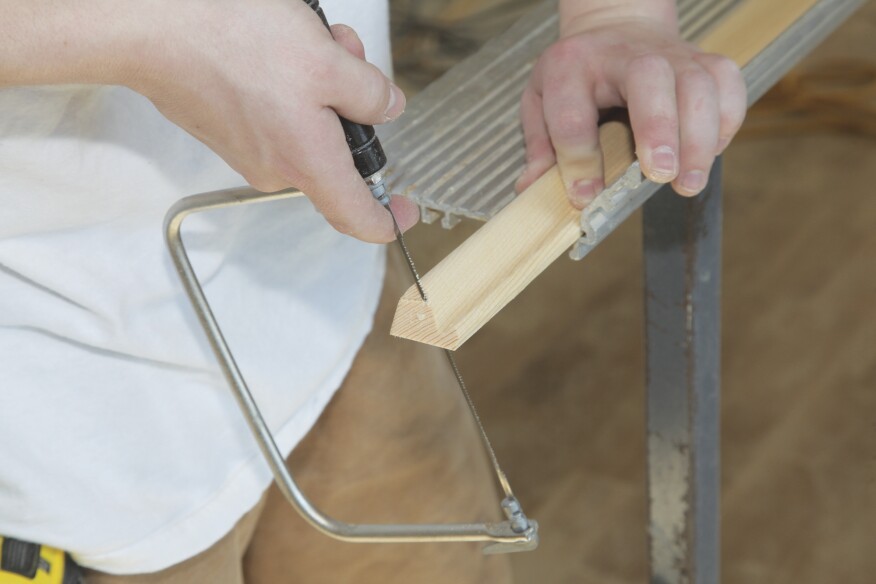 For base cap molding, begin by cutting across the profile from the bottom.