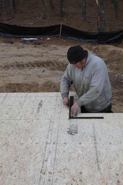 For walls 2 feet long or shorter, a framing square can be used to mark a line more quickly and easily than snapping a line.